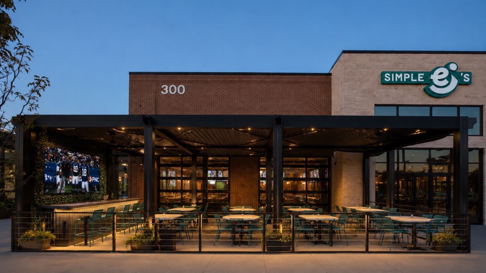 The patio and retractable pergola at Simple EJ's Kitchen & Tap at Fox Haven Square in St. Charles at dusk